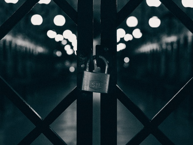 Black and white picture of locked gate