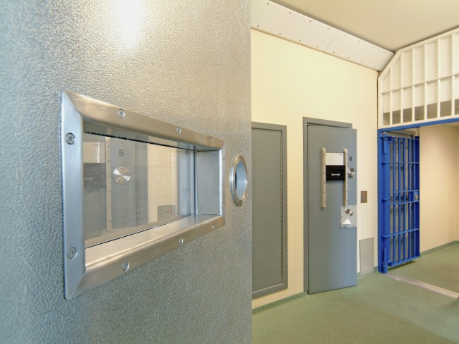 Interior view of a modern prison with open doors