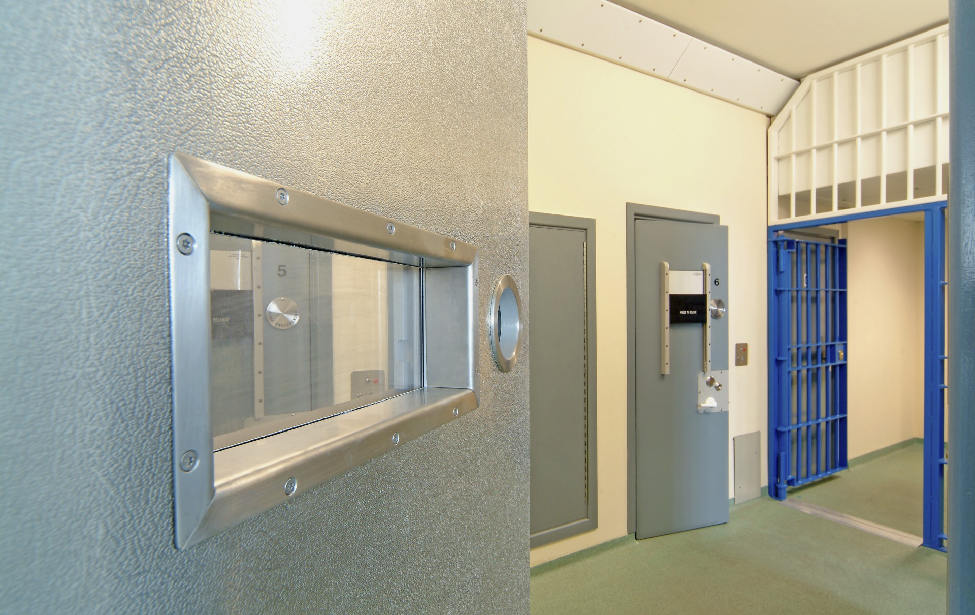Interior view of a modern prison with open doors